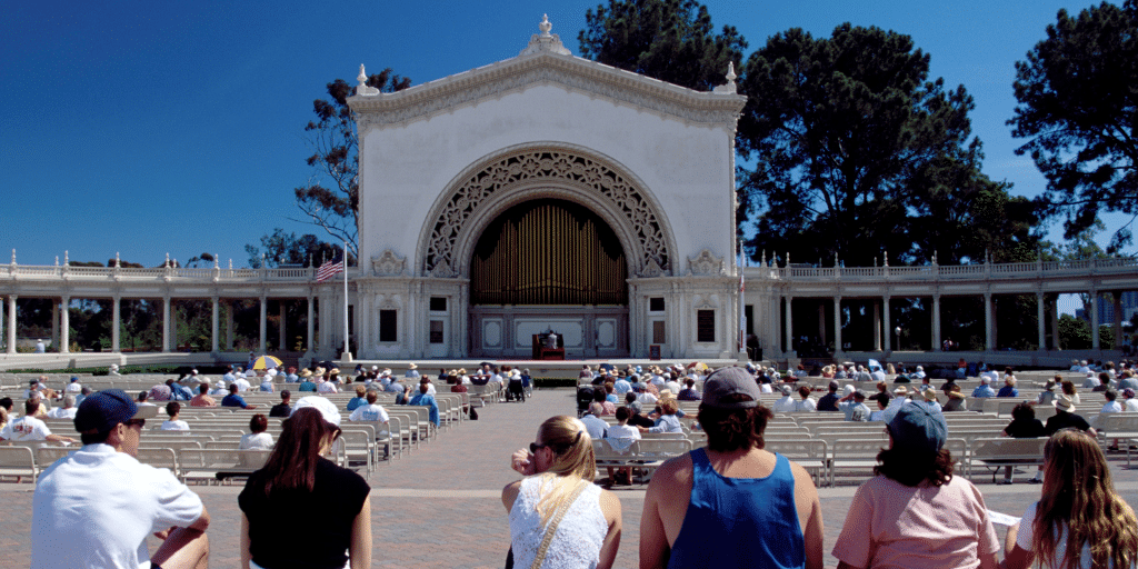 photo of people sitting at balboa amphitheater showing the cost of living in san diego