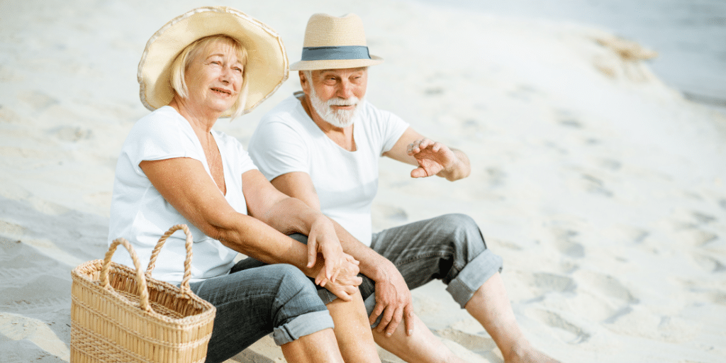 photo of senior couple sitting on the beach showing what is san diego known for