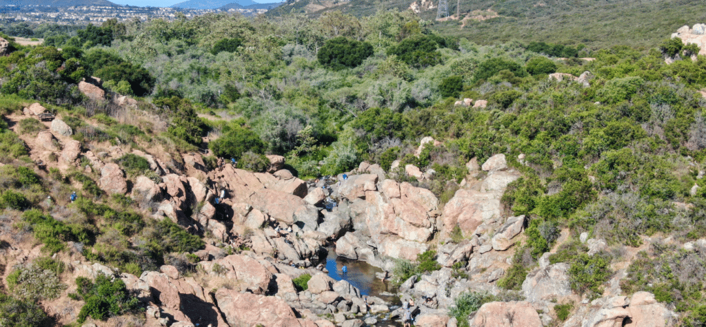 photo of people enjoying the hike at los penasquitos conyon preserve showing one of the best san diego hikes and trails
