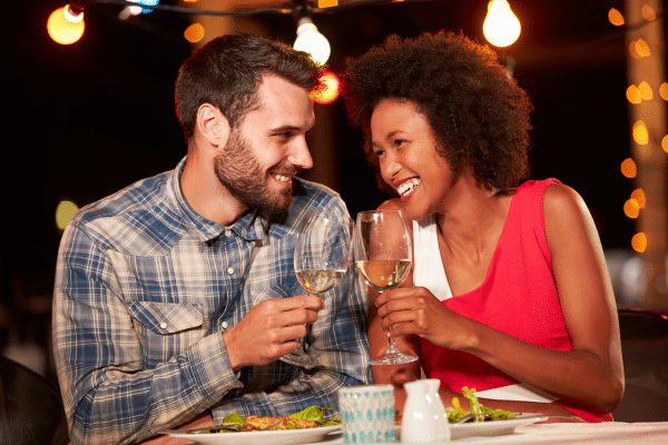 photo of couple having dinner showing things to do in san diego for couples